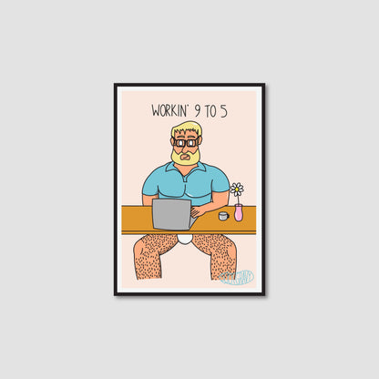 A framed art print with a white border on a light peach background. The print shows a cartoon man with blond hair and a beard sitting at a desk with a laptop, wearing only a blue shirt, with the text 'WORKIN' 9 TO 5' above him.